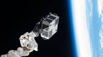 AggieSat4 on International Space Station deployment arm